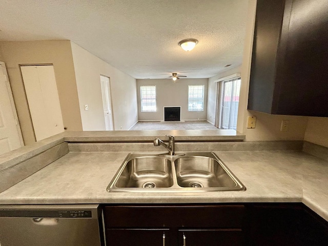 1915 N Hicks Rd Unit 105, Palatine, IL 60074 - kitchen with a sink, light countertops, dark brown cabinetry, dishwasher, and a ceiling fan