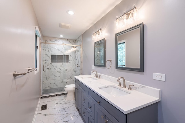 bathroom featuring a sink, marble finish floor, a marble finish shower, and toilet