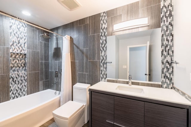 full bath with vanity, visible vents, toilet, and shower / tub combo