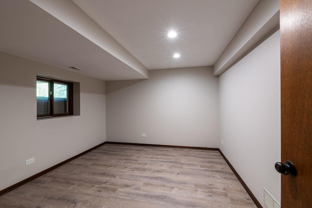 empty room featuring recessed lighting, baseboards, visible vents, and light wood-style flooring
