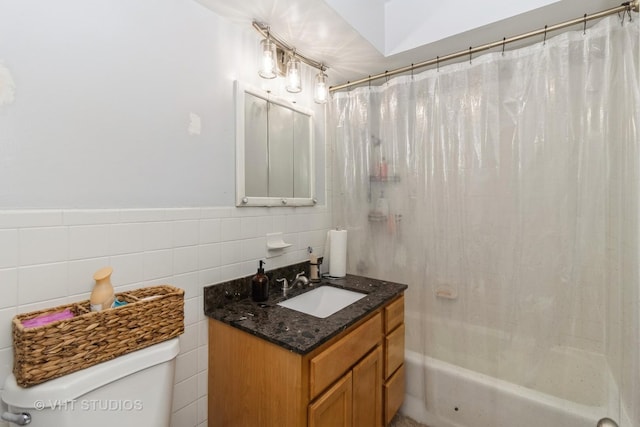 full bath with vanity, shower / bath combination with curtain, toilet, and tile walls