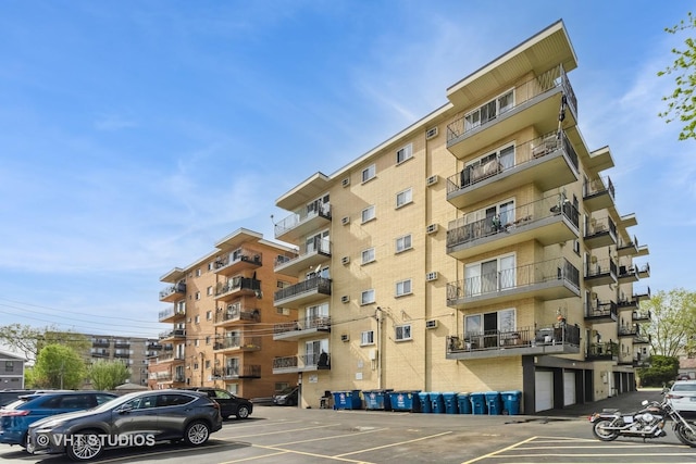 view of property with uncovered parking
