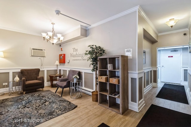 7428 Washington St Unit 304, Forest Park, IL 60130 - interior space featuring crown molding, a wall mounted AC, an inviting chandelier, and wood finished floors