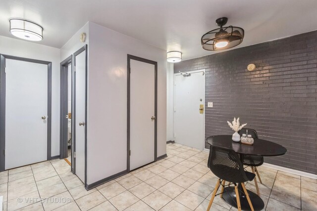 7428 Washington St Unit 304, Forest Park, IL 60130 - interior space with brick wall and light tile patterned flooring
