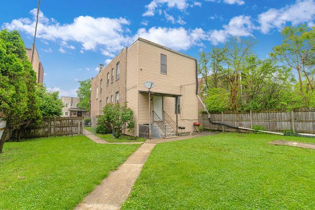 98 W 15th St, Chicago Heights, IL 60411 - rear view of house with a lawn, entry steps, and a fenced backyard
