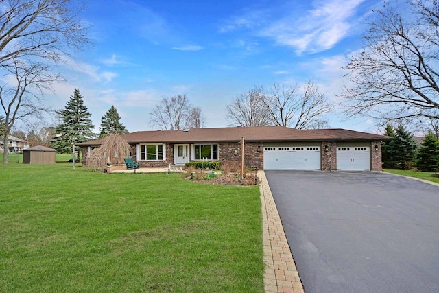 25441 N Marilyn Ln, Hawthorn Woods, IL 60047 - ranch-style home with a front yard, a garage, aphalt driveway, a storage shed, and brick siding