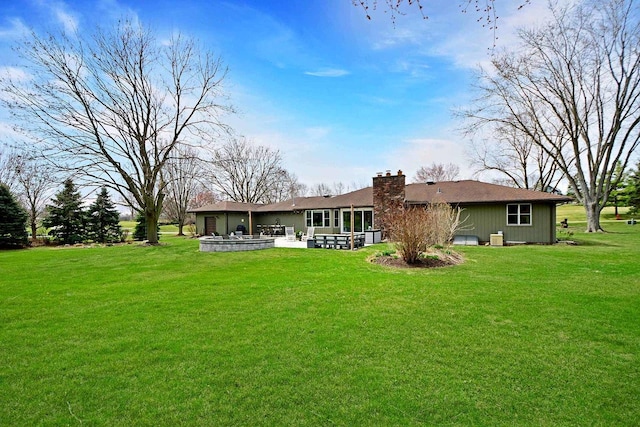 25441 N Marilyn Ln, Hawthorn Woods, IL 60047 - rear view of house featuring a lawn, a chimney, and a patio area