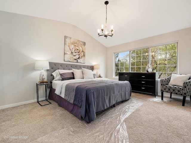 bedroom featuring an inviting chandelier, light colored carpet, lofted ceiling, and baseboards