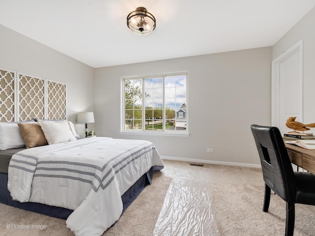 bedroom featuring carpet flooring, baseboards, and visible vents