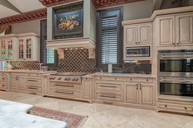 113 Carmela Ct, Bloomingdale, IL 60108 - kitchen featuring stainless steel appliances, cream cabinetry, tasteful backsplash, and healthy amount of natural light