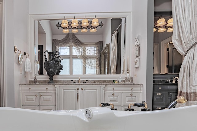 113 Carmela Ct, Bloomingdale, IL 60108 - bathroom featuring a freestanding bath and vanity