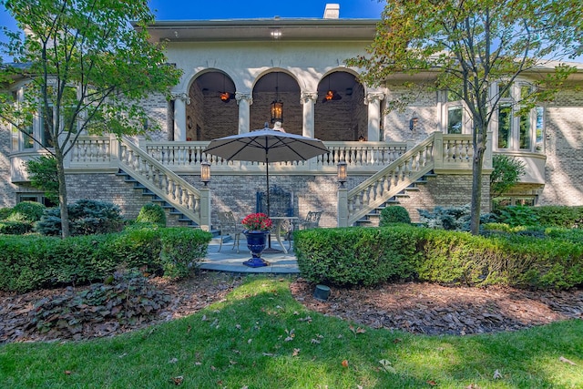 113 Carmela Ct, Bloomingdale, IL 60108 - view of front of home with stairway, a porch, and brick siding