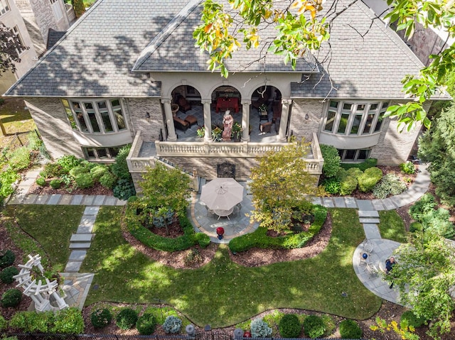 113 Carmela Ct, Bloomingdale, IL 60108 - back of property featuring a patio area, a high end roof, a lawn, brick siding, and stucco siding