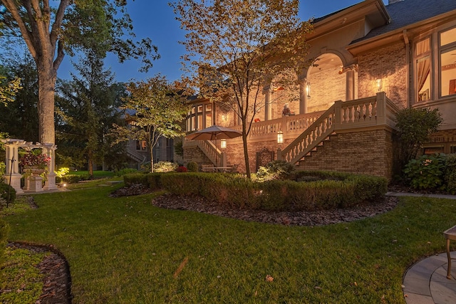 113 Carmela Ct, Bloomingdale, IL 60108 - view of side of property with stairway, a lawn, and stucco siding