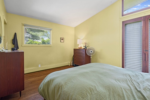 2110 Heather Rd, Geneva, IL 60134 - bedroom with a baseboard radiator, wood finished floors, vaulted ceiling, and baseboards