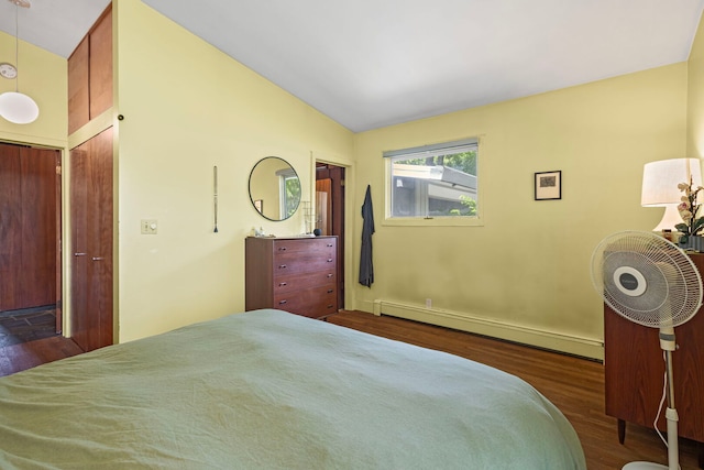 2110 Heather Rd, Geneva, IL 60134 - bedroom with wood finished floors, a baseboard heating unit, vaulted ceiling, and baseboards
