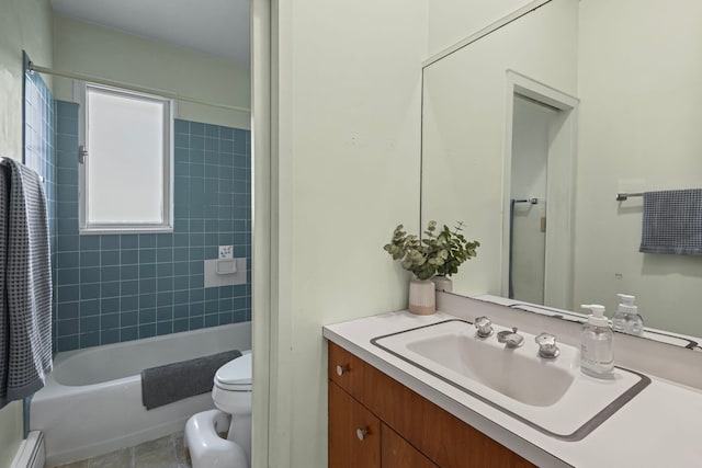 2110 Heather Rd, Geneva, IL 60134 - bathroom featuring baseboard heating, vanity, toilet, and bathtub / shower combination