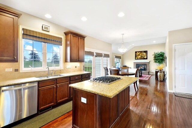 35 Open Pkwy N, Hawthorn Woods, IL 60047 - kitchen featuring stainless steel appliances, a sink, dark wood-type flooring, a kitchen island, and decorative backsplash