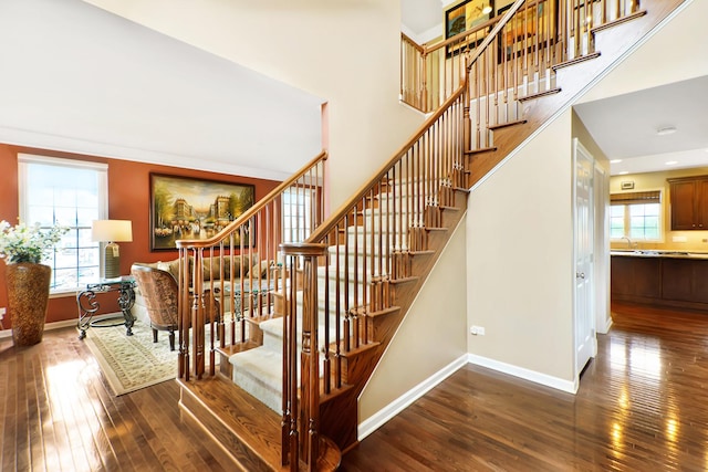 35 Open Pkwy N, Hawthorn Woods, IL 60047 - staircase featuring wood-type flooring, baseboards, a high ceiling, and recessed lighting