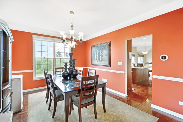 35 Open Pkwy N, Hawthorn Woods, IL 60047 - dining area with a chandelier, dark wood-style floors, healthy amount of natural light, and baseboards