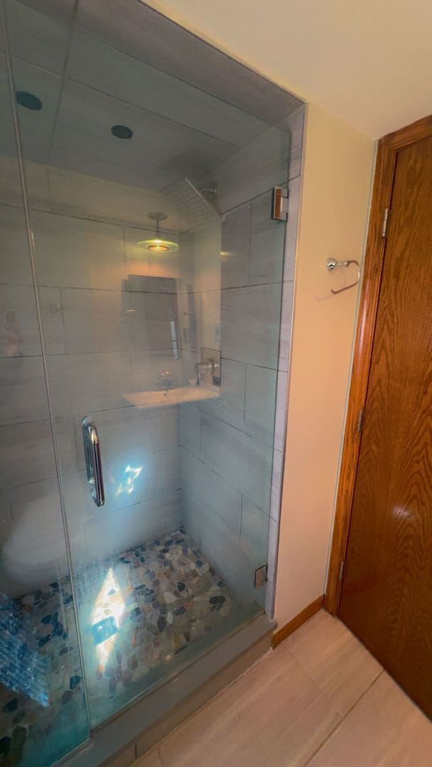 bathroom featuring a stall shower and tile patterned flooring