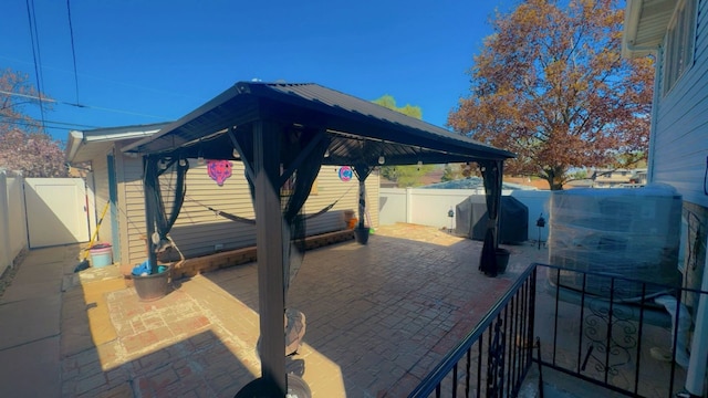 view of patio / terrace featuring a gazebo and a fenced backyard