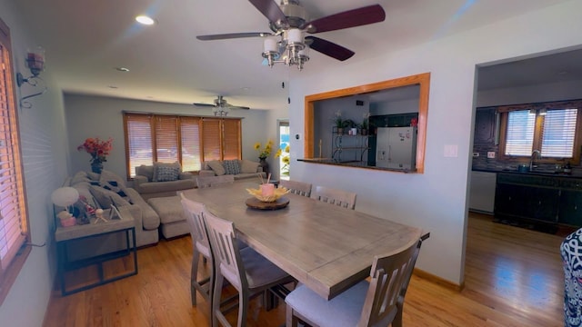 dining space featuring wood finished floors, ceiling fan, recessed lighting, and baseboards
