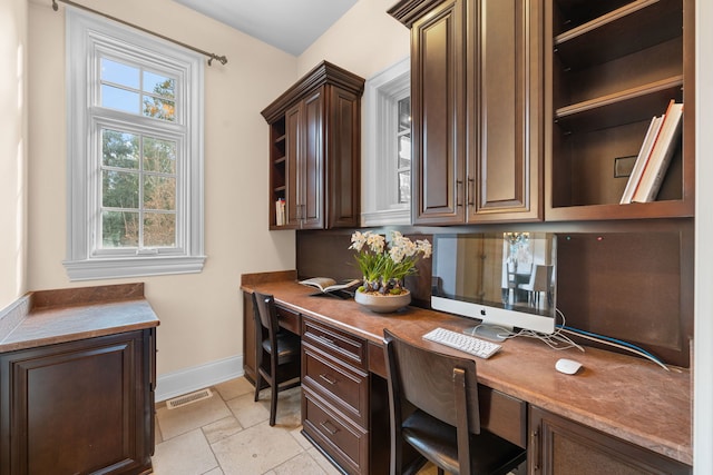 26W051 W Mohican Dr, Wheaton, IL 60189 - office with built in study area, baseboards, stone finish floor, and visible vents