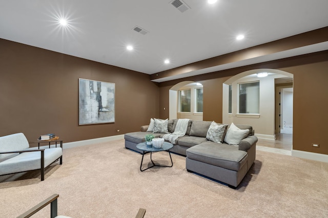 26W051 W Mohican Dr, Wheaton, IL 60189 - living room featuring arched walkways, visible vents, and light carpet