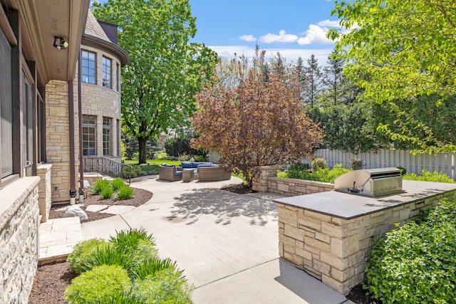 26W051 W Mohican Dr, Wheaton, IL 60189 - view of patio / terrace with an outdoor kitchen, an outdoor hangout area, and fence