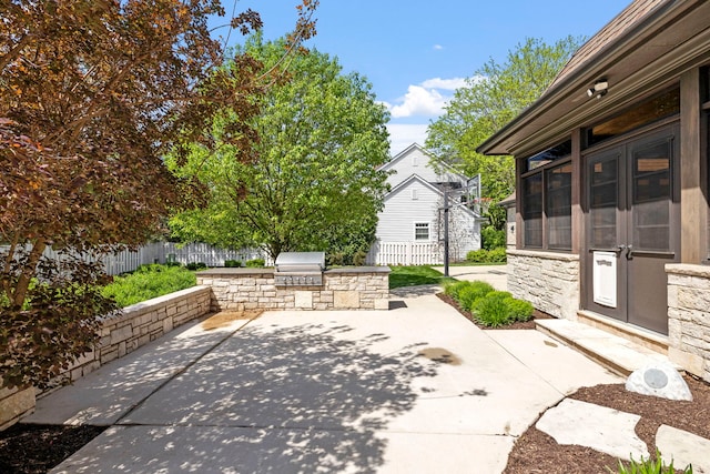 26W051 W Mohican Dr, Wheaton, IL 60189 - view of patio / terrace featuring grilling area, exterior kitchen, and fence