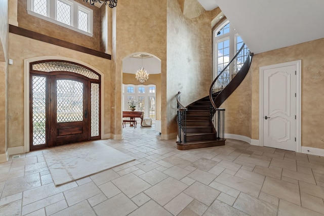26W051 W Mohican Dr, Wheaton, IL 60189 - entrance foyer with a high ceiling, a chandelier, and plenty of natural light