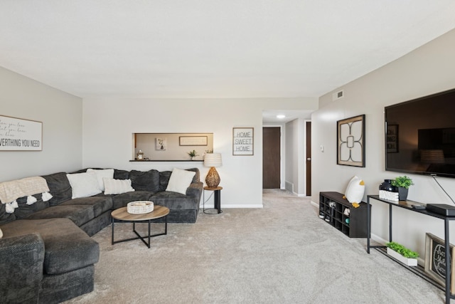 carpeted living room featuring baseboards and visible vents