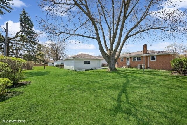 view of yard featuring central AC unit