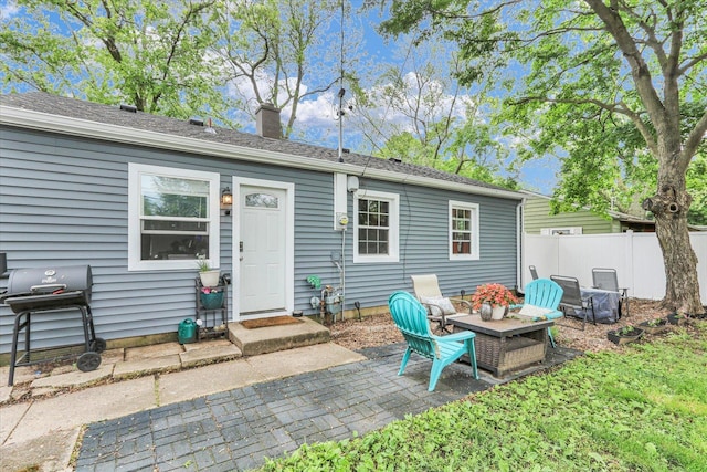 1304 Briarcliff Dr, Urbana, IL 61801 - rear view of house featuring a chimney and a patio area