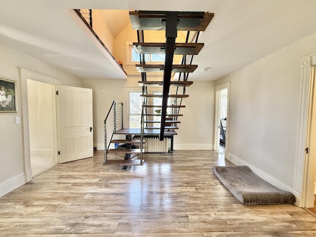 interior space with light wood-style floors and baseboards