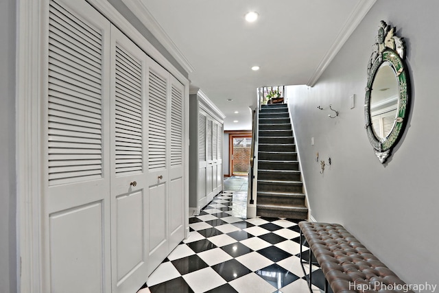 hallway featuring crown molding, recessed lighting, baseboards, and stairs