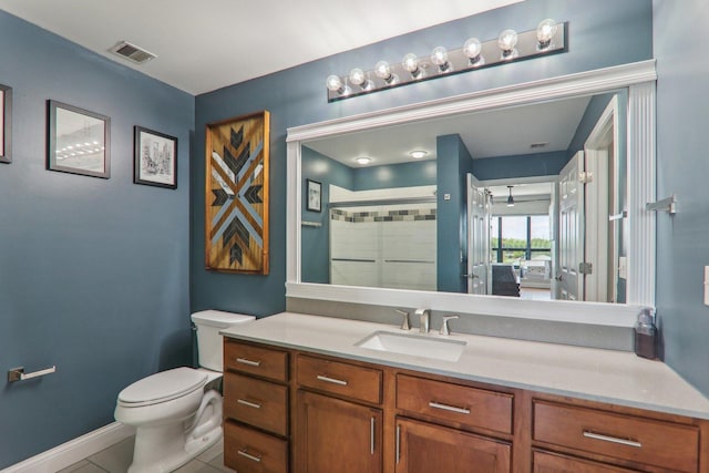 full bath featuring a shower stall, vanity, tile patterned floors, toilet, and visible vents