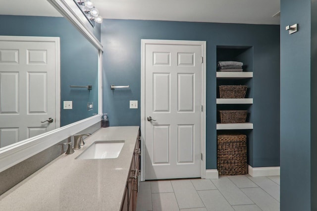 bathroom featuring tile patterned floors and vanity