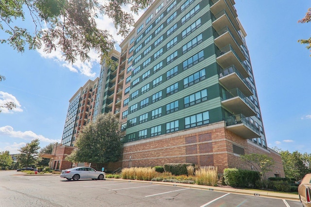 view of property with uncovered parking