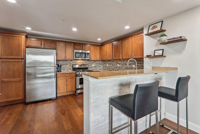 kitchen featuring open shelves, stainless steel appliances, dark wood-style floors, brown cabinetry, and backsplash