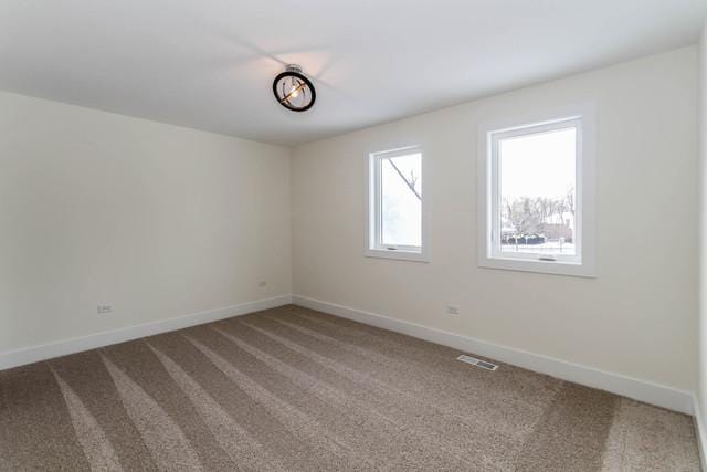 313 Lincoln St, Schaumburg, IL 60194 - spare room featuring visible vents, carpet flooring, and baseboards