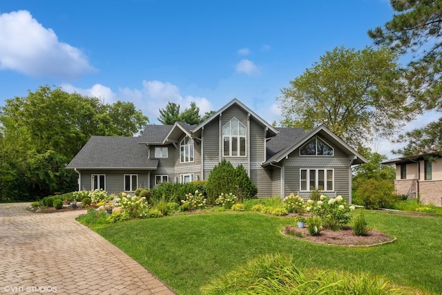 18W742 60th St, Westmont, IL 60559 - view of front of house featuring a front lawn and roof with shingles