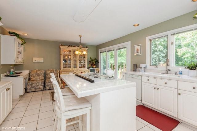 18W742 60th St, Westmont, IL 60559 - washroom featuring recessed lighting, an inviting chandelier, light tile patterned flooring, and a sink
