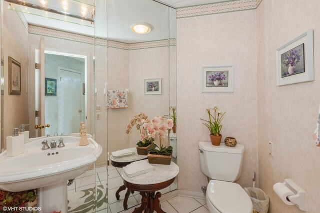 18W742 60th St, Westmont, IL 60559 - bathroom featuring toilet, tile patterned flooring, and a sink