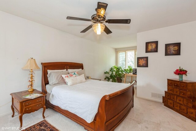 18W742 60th St, Westmont, IL 60559 - carpeted bedroom featuring baseboards, visible vents, and a ceiling fan