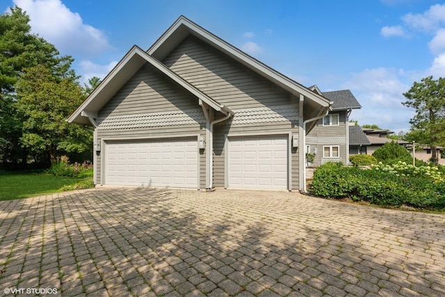 18W742 60th St, Westmont, IL 60559 - view of front facade featuring decorative driveway and an attached garage