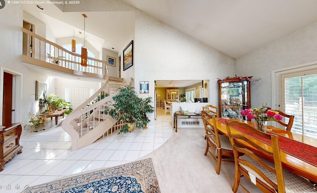 18W742 60th St, Westmont, IL 60559 - dining room featuring stairway, light tile patterned floors, and high vaulted ceiling