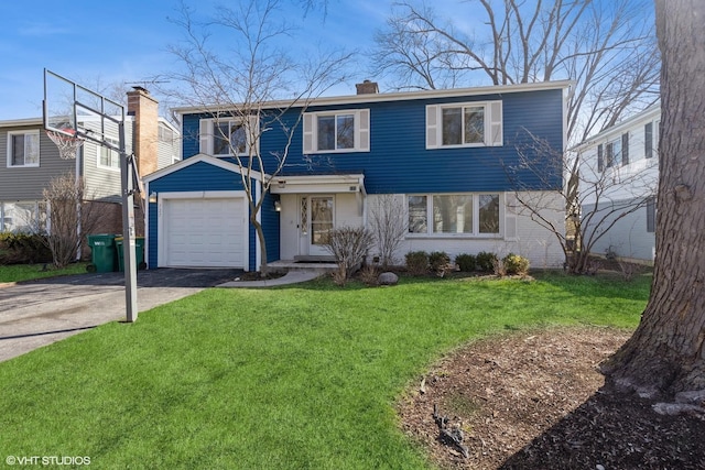 127 Riverside Dr, Northfield, IL 60093 - traditional home with a chimney, brick siding, aphalt driveway, a garage, and a front lawn
