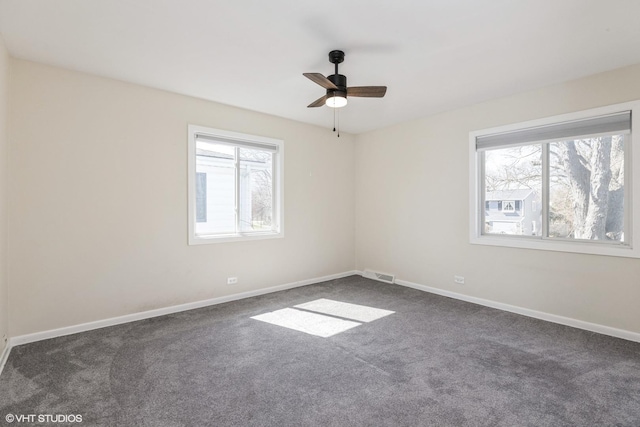 127 Riverside Dr, Northfield, IL 60093 - spare room with baseboards, visible vents, ceiling fan, and carpet floors